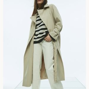 Double breasted beige trench coat